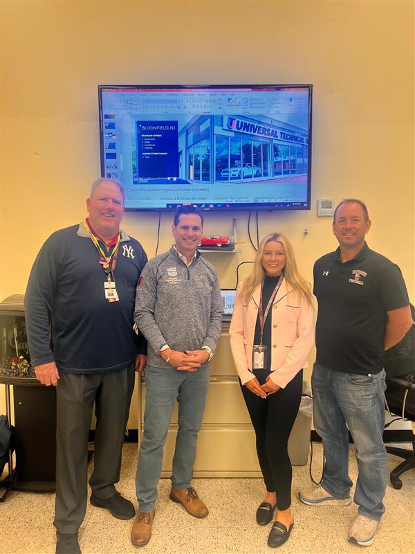 VP Mattei and Vocational Staff members pose with UTI rep.